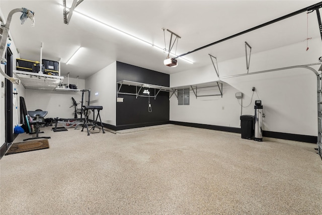 garage featuring a garage door opener and electric panel