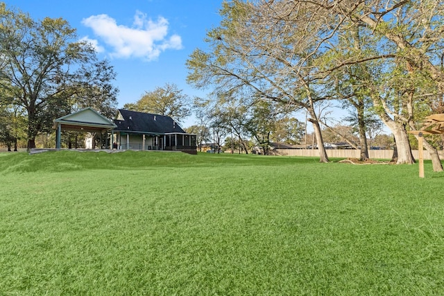 view of yard with a sunroom