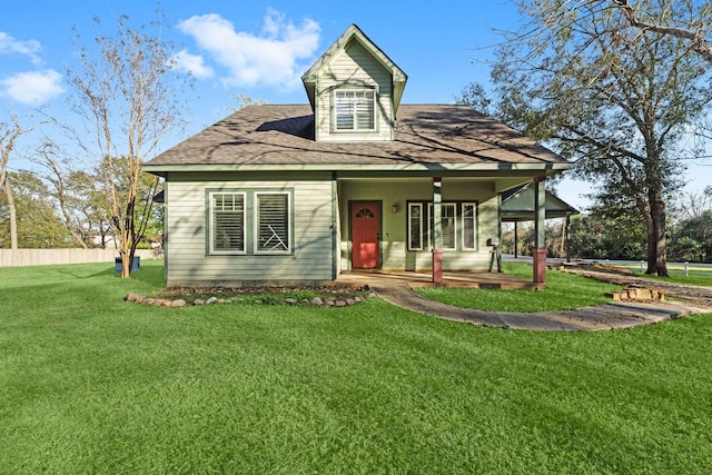 view of front of house with a porch and a front yard