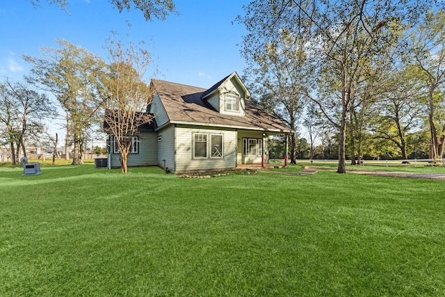 view of property exterior featuring a lawn and cooling unit