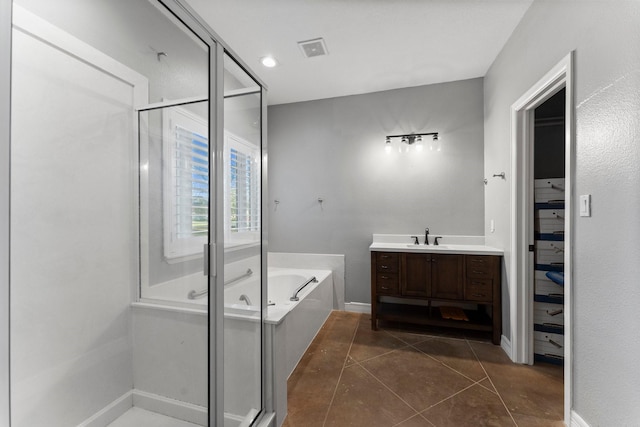 bathroom with separate shower and tub, tile patterned flooring, and vanity