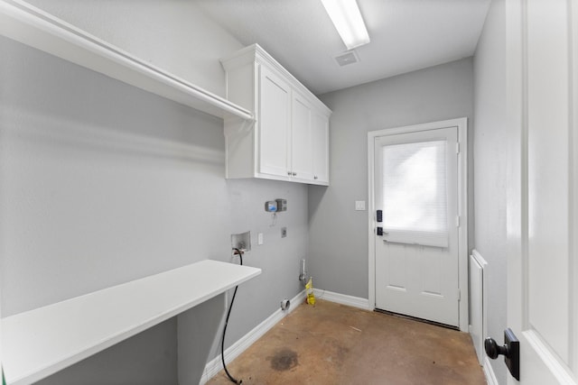 clothes washing area with electric dryer hookup, gas dryer hookup, cabinets, and washer hookup