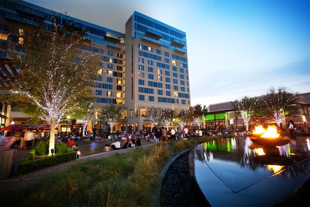 view of outdoor building at dusk