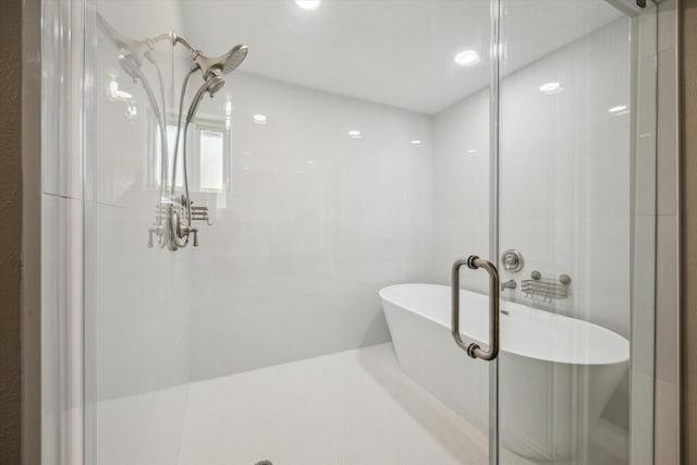 bathroom with shower with separate bathtub