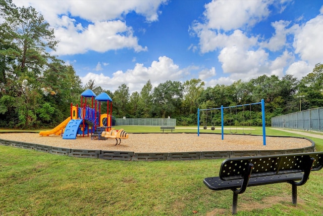 view of playground with a lawn