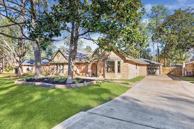 view of front facade featuring a front yard and a garage