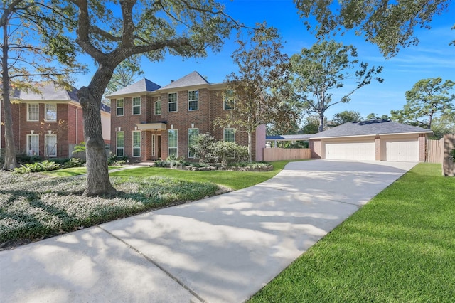 view of front of house featuring a garage and a front yard