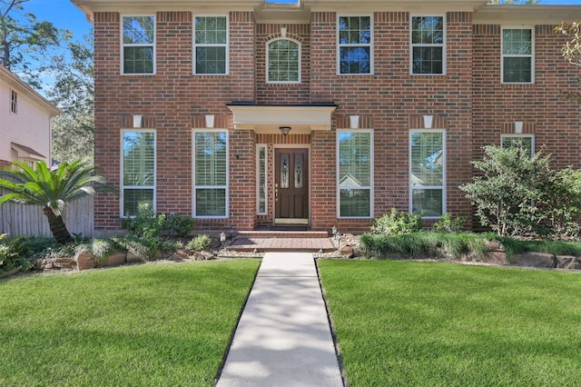 view of front of home with a front lawn