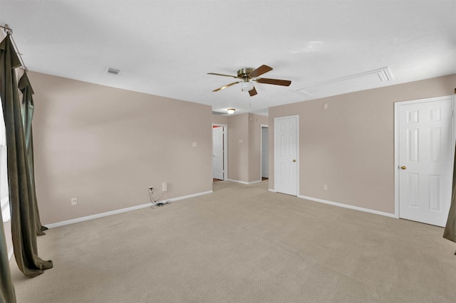 unfurnished room featuring ceiling fan and light carpet