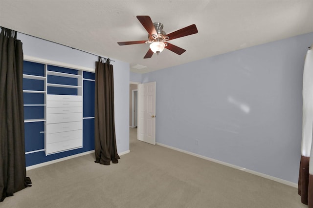 interior space with ceiling fan