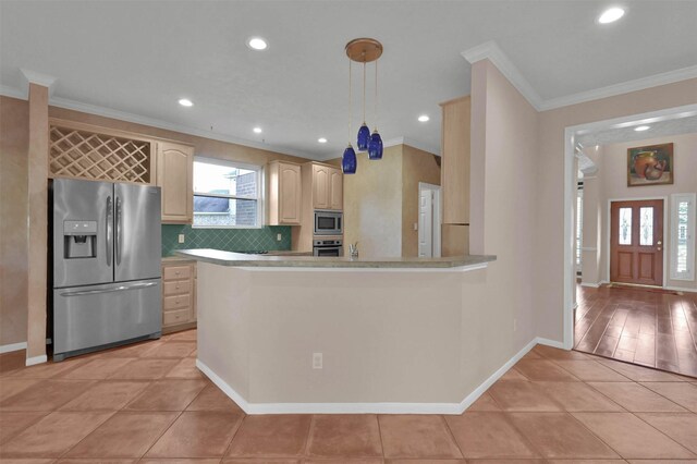 kitchen with crown molding, light tile patterned floors, stainless steel appliances, and hanging light fixtures