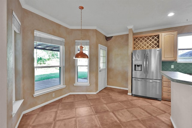 kitchen featuring crown molding, hanging light fixtures, decorative backsplash, stainless steel fridge, and light brown cabinetry