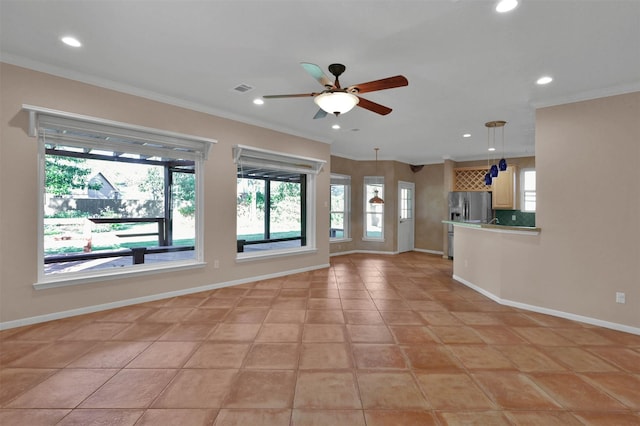 unfurnished living room with ceiling fan, light tile patterned floors, and crown molding