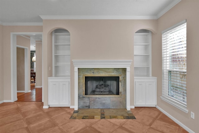 unfurnished living room with built in features, light tile patterned flooring, and ornamental molding