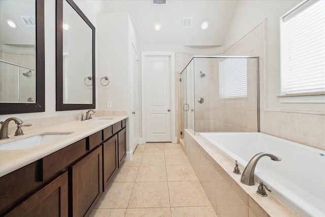 bathroom featuring shower with separate bathtub, vanity, tile patterned floors, and vaulted ceiling