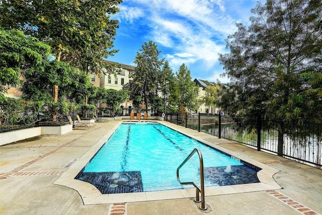 view of swimming pool with a patio area