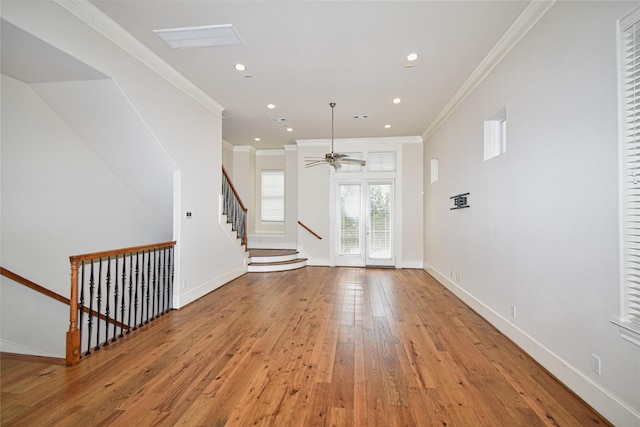 unfurnished living room featuring ceiling fan, light hardwood / wood-style floors, and crown molding