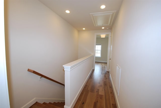 hall with wood-type flooring