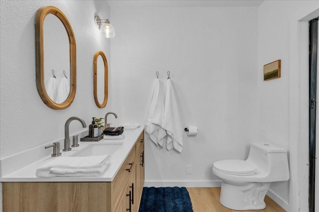 1411 Clay St, Brenham, TX 77833 - bathroom with double vanity and wood finished floors