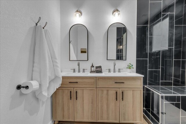 1411 Clay St, Brenham, TX 77833 - full bathroom with double vanity and a tile shower