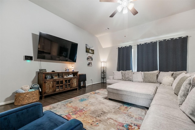 living room featuring vaulted ceiling, ceiling fan, and dark hardwood / wood-style flooring