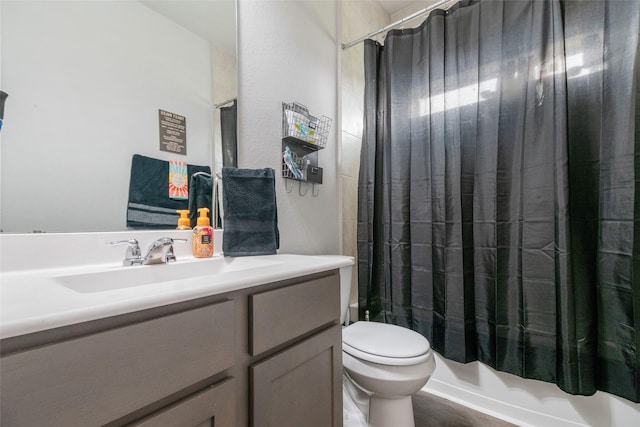 full bathroom featuring toilet, shower / bath combo with shower curtain, wood-type flooring, and vanity