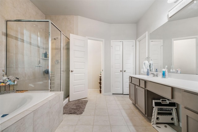 bathroom featuring vanity, tile patterned floors, and separate shower and tub