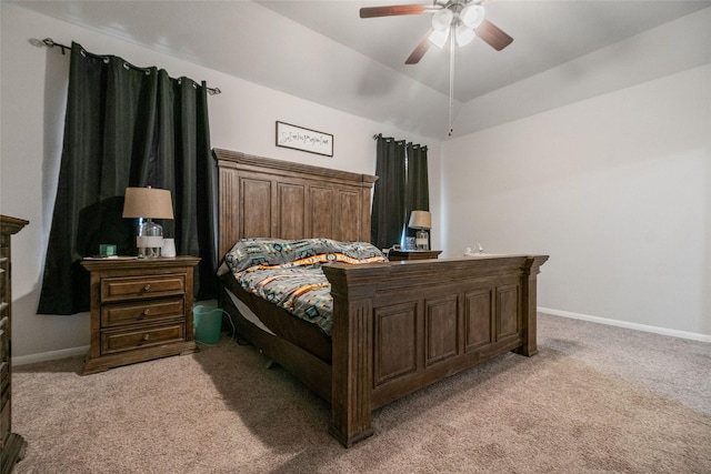 carpeted bedroom featuring ceiling fan and vaulted ceiling