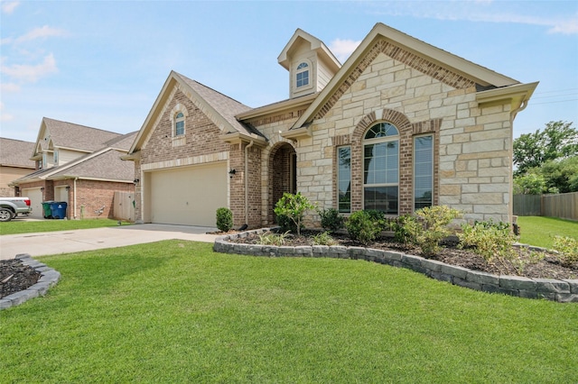 view of front of home with a garage and a front yard