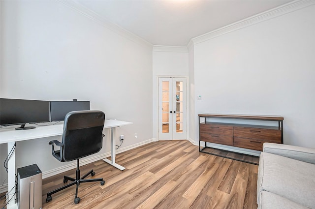 office with crown molding, french doors, and light hardwood / wood-style flooring