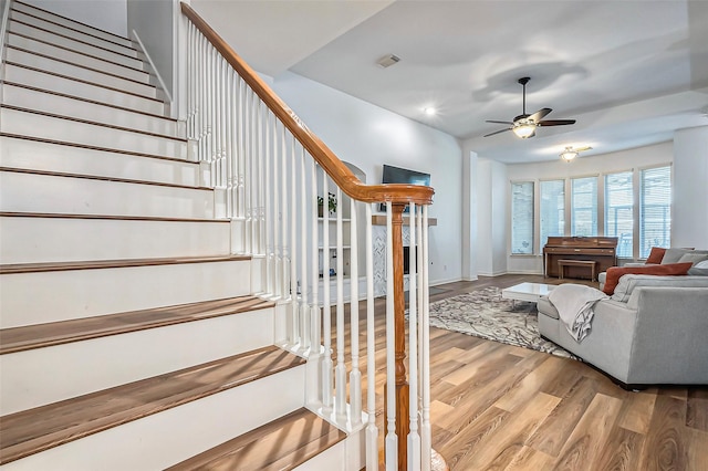 living room with ceiling fan and hardwood / wood-style floors