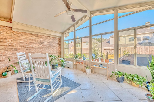 unfurnished sunroom featuring ceiling fan and lofted ceiling