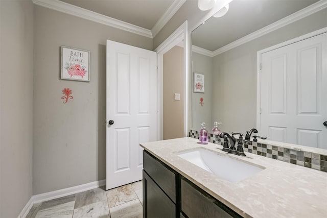 bathroom with vanity, ornamental molding, and backsplash