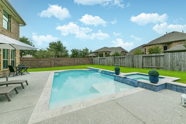 view of swimming pool featuring an in ground hot tub and a patio area