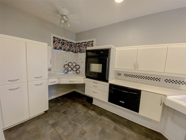 kitchen featuring white cabinetry, black oven, and ceiling fan