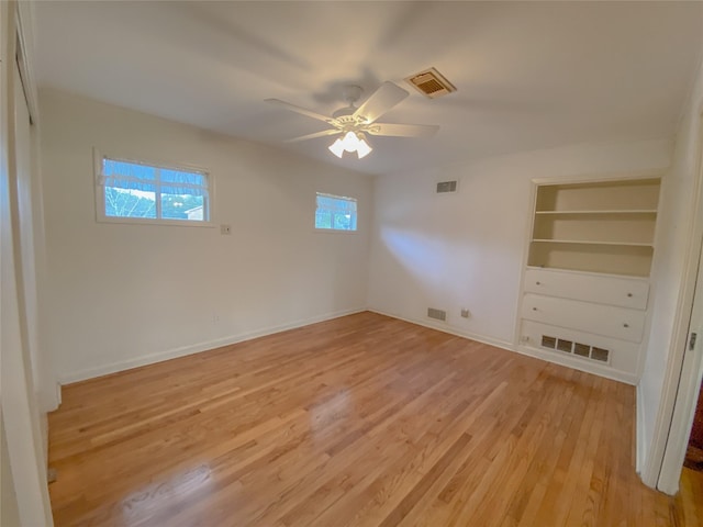 unfurnished bedroom featuring ceiling fan and light wood-type flooring