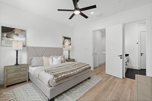 bedroom with hardwood / wood-style flooring and ceiling fan