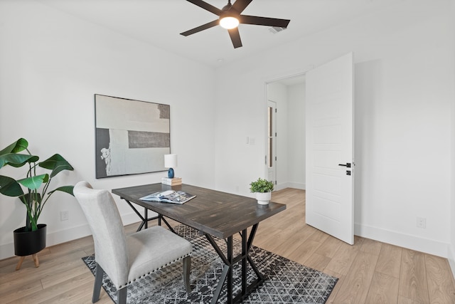 office featuring light wood-type flooring and ceiling fan