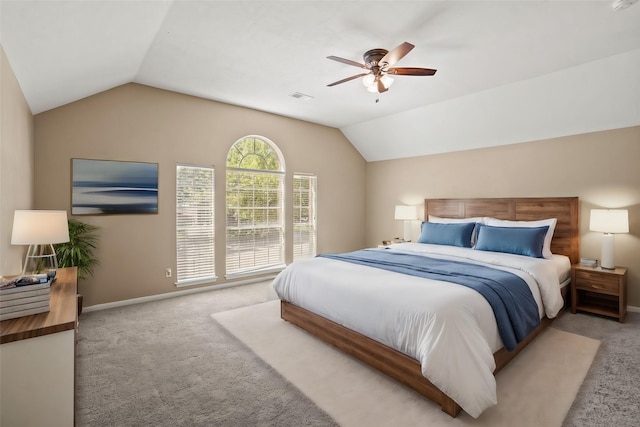 carpeted bedroom featuring ceiling fan and lofted ceiling