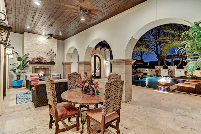 dining area featuring ceiling fan, wooden ceiling, and ornamental molding