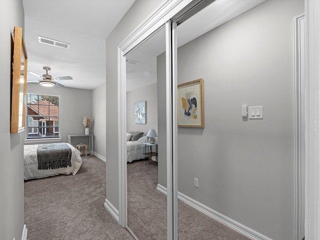 carpeted bedroom featuring ceiling fan