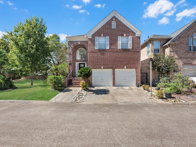 view of property with a front yard and a garage