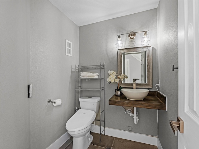 bathroom with sink and toilet