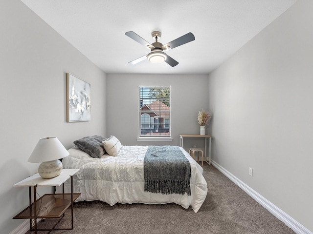 bedroom featuring dark colored carpet and ceiling fan