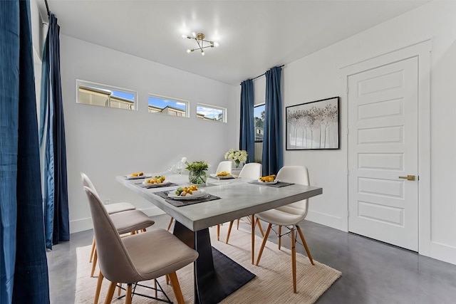 dining area featuring an inviting chandelier