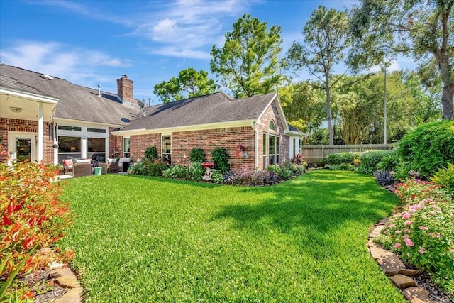 exterior space with a lawn and an outdoor hangout area