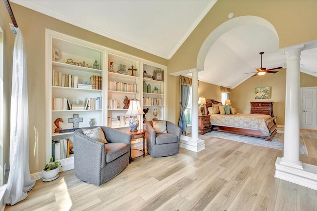 bedroom with decorative columns, ceiling fan, lofted ceiling, and light wood-type flooring