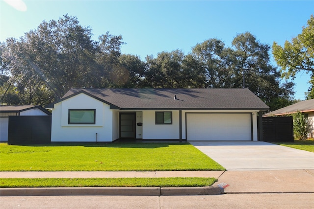 ranch-style house with a front lawn and a garage