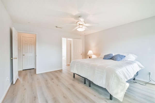 bedroom with light wood-type flooring and ceiling fan