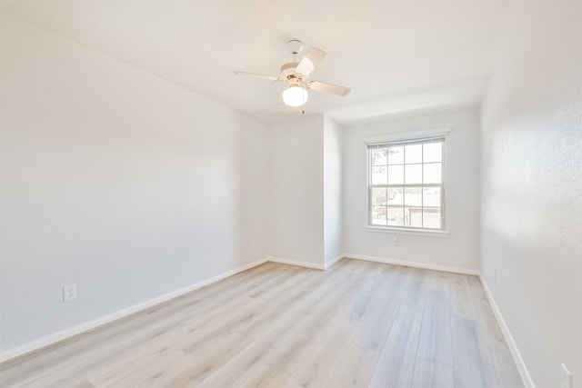 spare room featuring ceiling fan and light hardwood / wood-style flooring